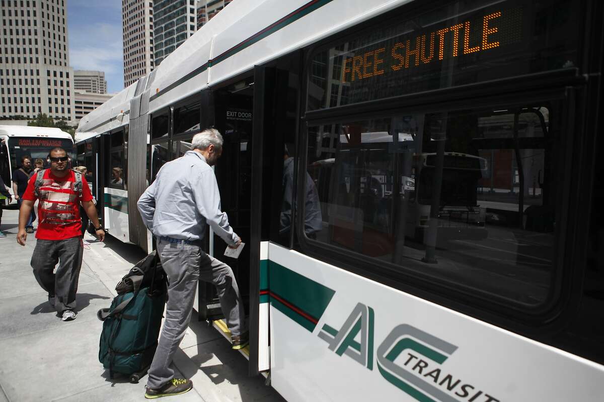 Bay area residents one of the shuttles provided at the temporary Transbay Terminal on Sunday, August 2, 2015. Free shuttle service was offered in response to BART's shutdown during the weekend.