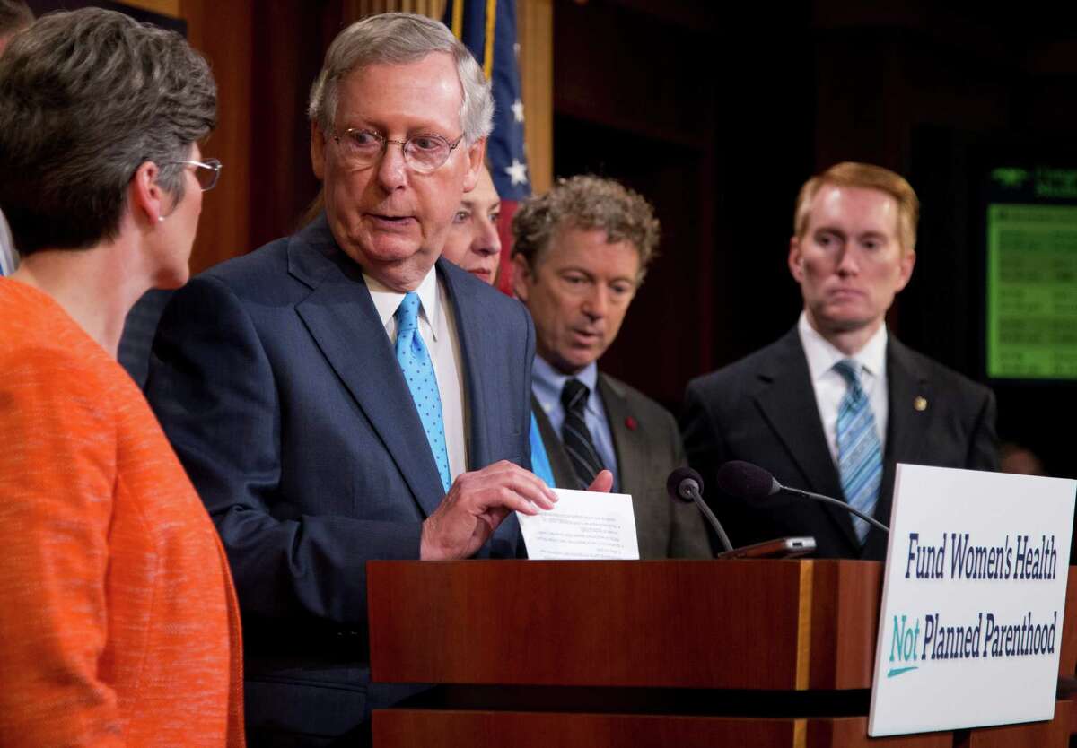 Senate Majority Leader Mitch McConnell of Ky., and Sens. Sen. John Thune, Joni Ernst, Rand Paul, and James Lankford, speak during a news conference on Capitol Hill in Washington on July 29, 2015, to discuss Planned Parenthood.