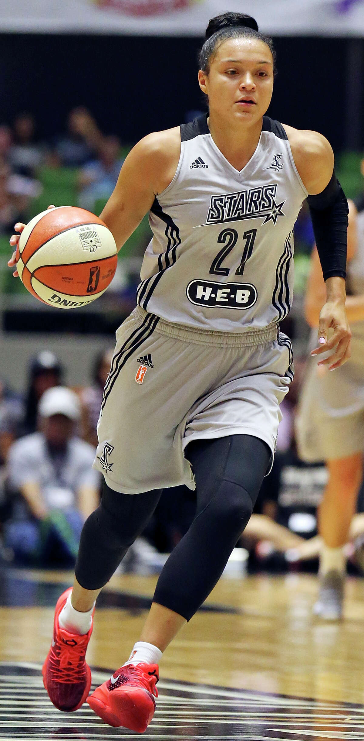 San Antonio Stars’ Kayla McBride heads up court during first half action against the Los Angeles Sparks Sunday Aug. 2, 2015 at the Freeman Coliseum.