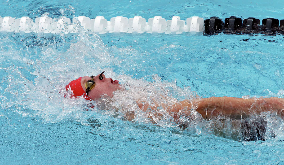 Josh Artmann competes in the men's 200-meter backstroke during the 2015 Speedo Junior National Championships held Friday July 31, 2015 at the Northside Swim Center. Artmann finished in second place with a time of 2:01.23. Austin Katz finished in first place with a time of 1:59.14. David Crossland finished in third place with a time of 2:01.52.