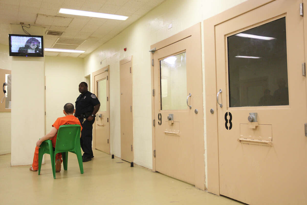 This file photo shows a deputy watchings over inmates in the Suicide Prevention Unit of the Bexar County Jail in 2012. Although Bexar County updated procedures a few years ago, Sandra Bland’s death in Waller County again has put the spotlight on the issue in Texas.