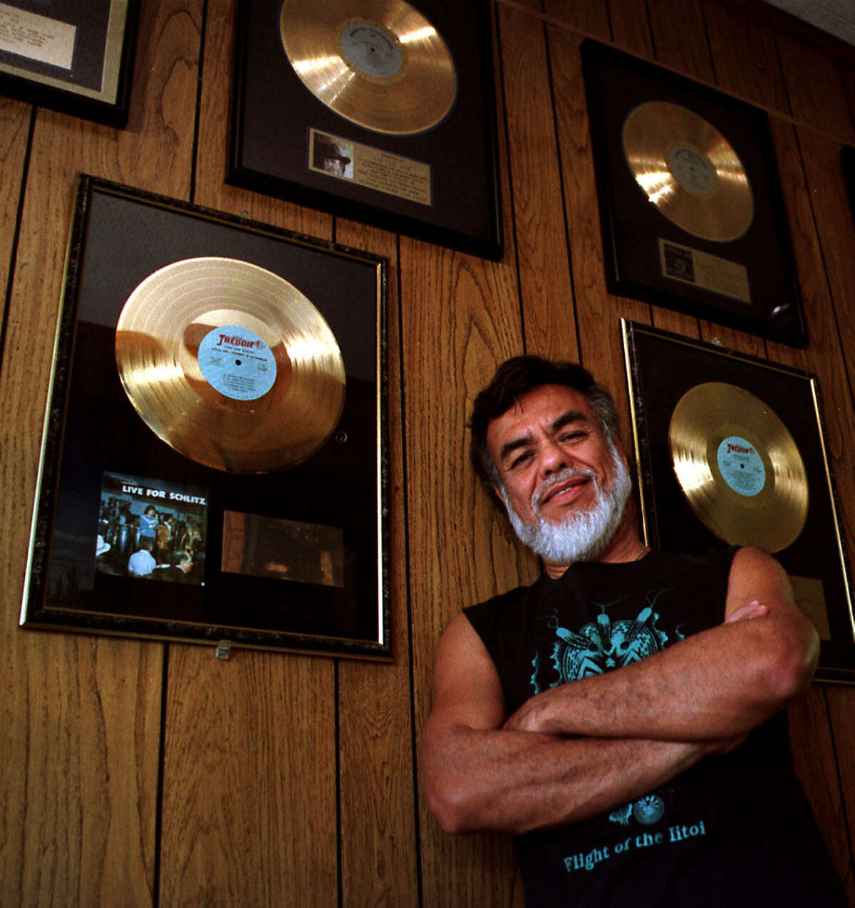 Little Joe Hernandez poses with a few of his gold records at his recording studio in Temple. He won the final mainstream Grammy Award for best Tejano album in 2011 for his album “Recuerdos.”