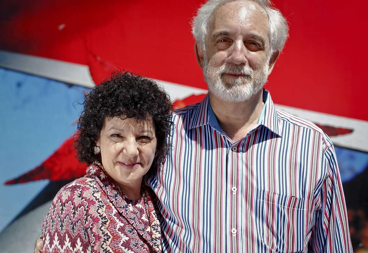 Mitch Kapor and Freada Kapor Klein stand in front of the new home of the Kapor Center for Social Impact that they are renovating in Oakland, Calif., on Wednesday, June 20, 2013.
