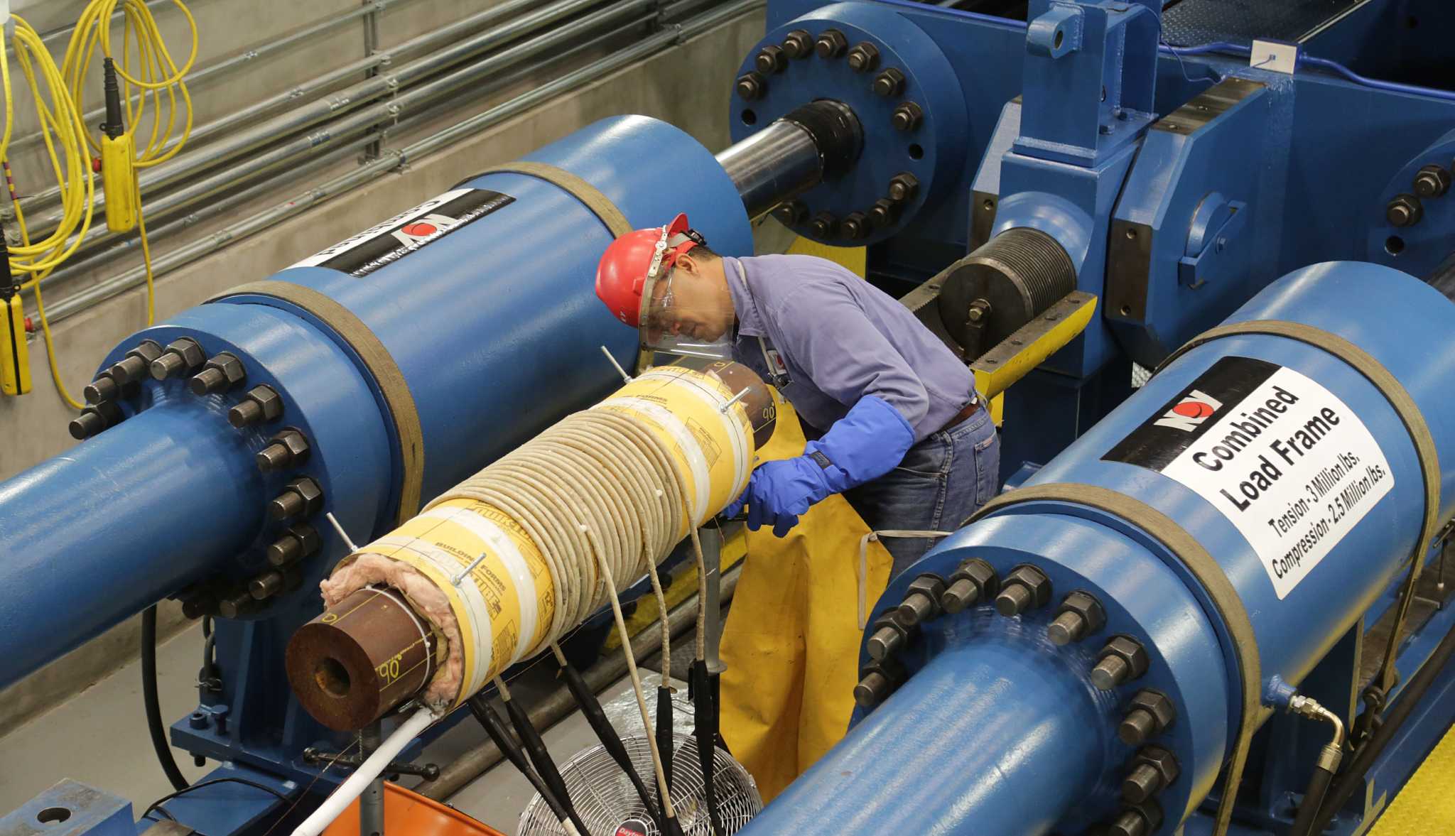 More layoffs, defaults expected as oil slides