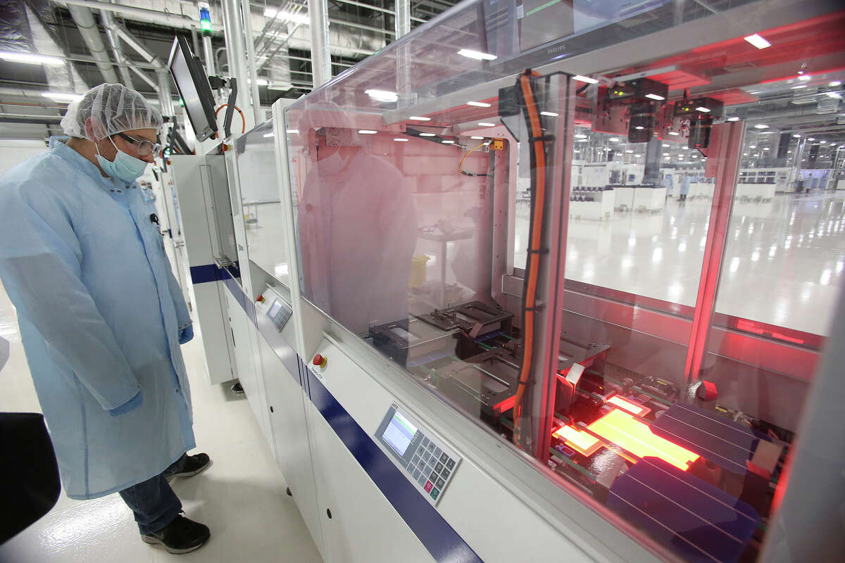 A light treatment is applied to wafers as they go through Mission Solar’s production line at Brooks City Base last fall.