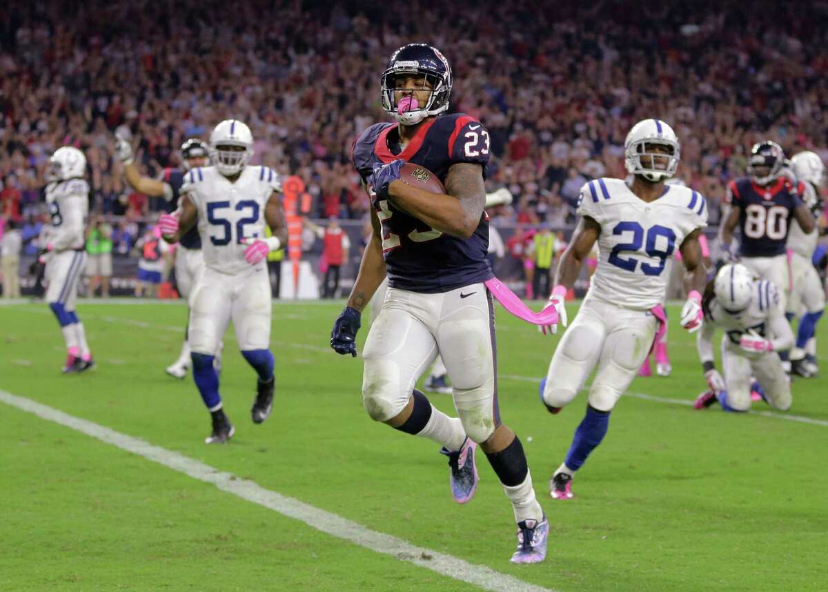 FILE - In this Oct. 9, 2014, file photo, Houston Texans' Arian Foster (23) runs for a touchdown against the Indianapolis Colts during the second quarter of an NFL football game in Houston. (AP Photo/Patric Schneider, File)