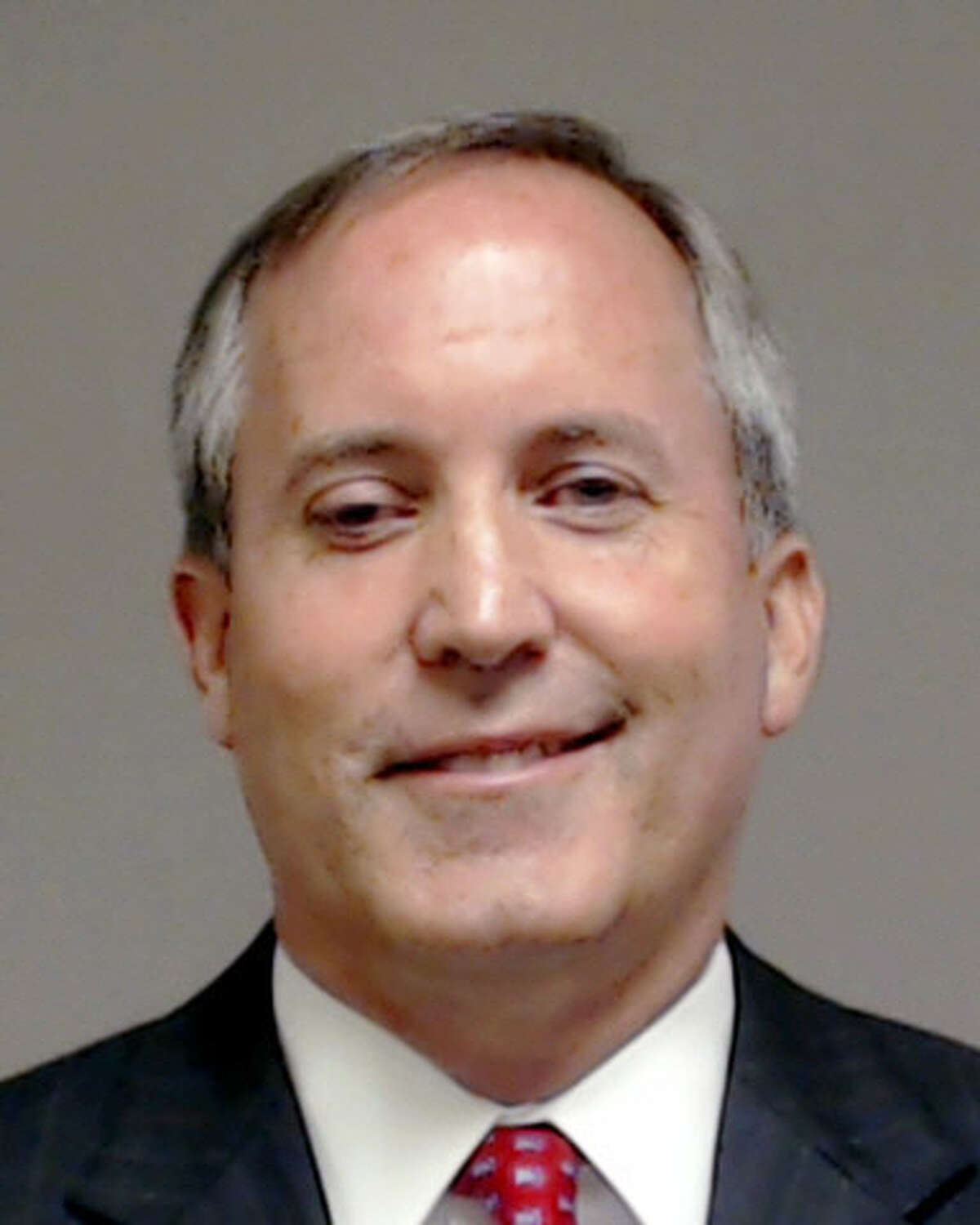 This handout photo provided by Collin County, Texas shows Texas Attorney General Kenneth Paxton, who was booked into the county jail Monday, Aug. 3, 2015, in McKinney, Texas. Take a closer look at some of the key numbers in the Paxton case. 