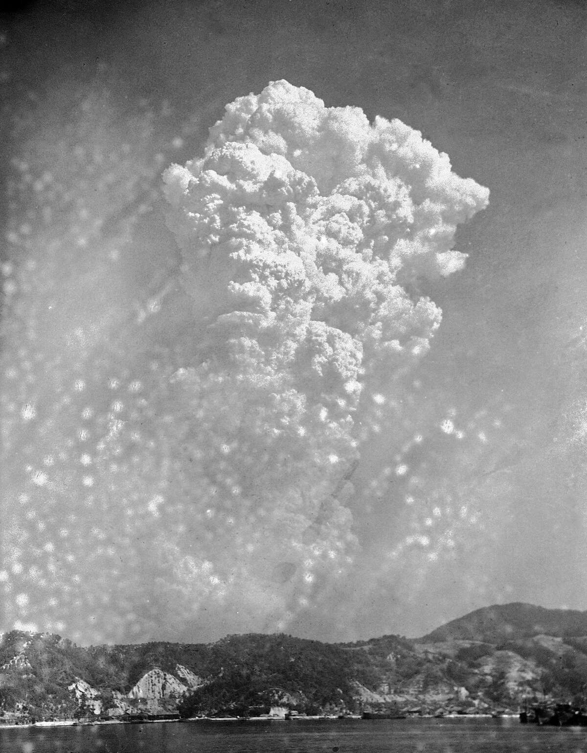 FILE- In this Aug. 6, 1945, file photo, smoke rises around 20,000 feet above Hiroshima, Japan, after the first atomic bomb was dropped. On two days in August 1945, U.S. planes dropped two atomic bombs, one on Hiroshima, one on Nagasaki, the first and only time nuclear weapons have been used. Their destructive power was unprecedented, incinerating buildings and people, and leaving lifelong scars on survivors, not just physical but also psychological, and on the cities themselves. Days later, World War II was over. (AP Photo, File)
