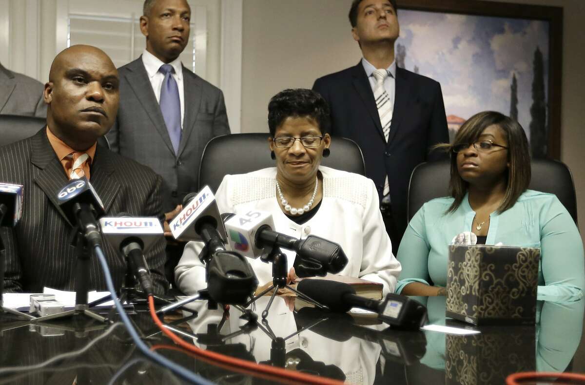 Attorney Cannon Lambert, left, along with Sandra Bland's mother, Geneva Reed-Veal, center, and sister Sierra Cole hold a news conference, Tuesday, Aug. 4, 2015, in Houston. Bland was found dead in a Texas county jail three days after a confrontation with a white state trooper. The family filed a wrongful-death lawsuit against the officer and other officials, saying it was a last resort after being unable to get enough information about the case. (AP Photo/Pat Sullivan)