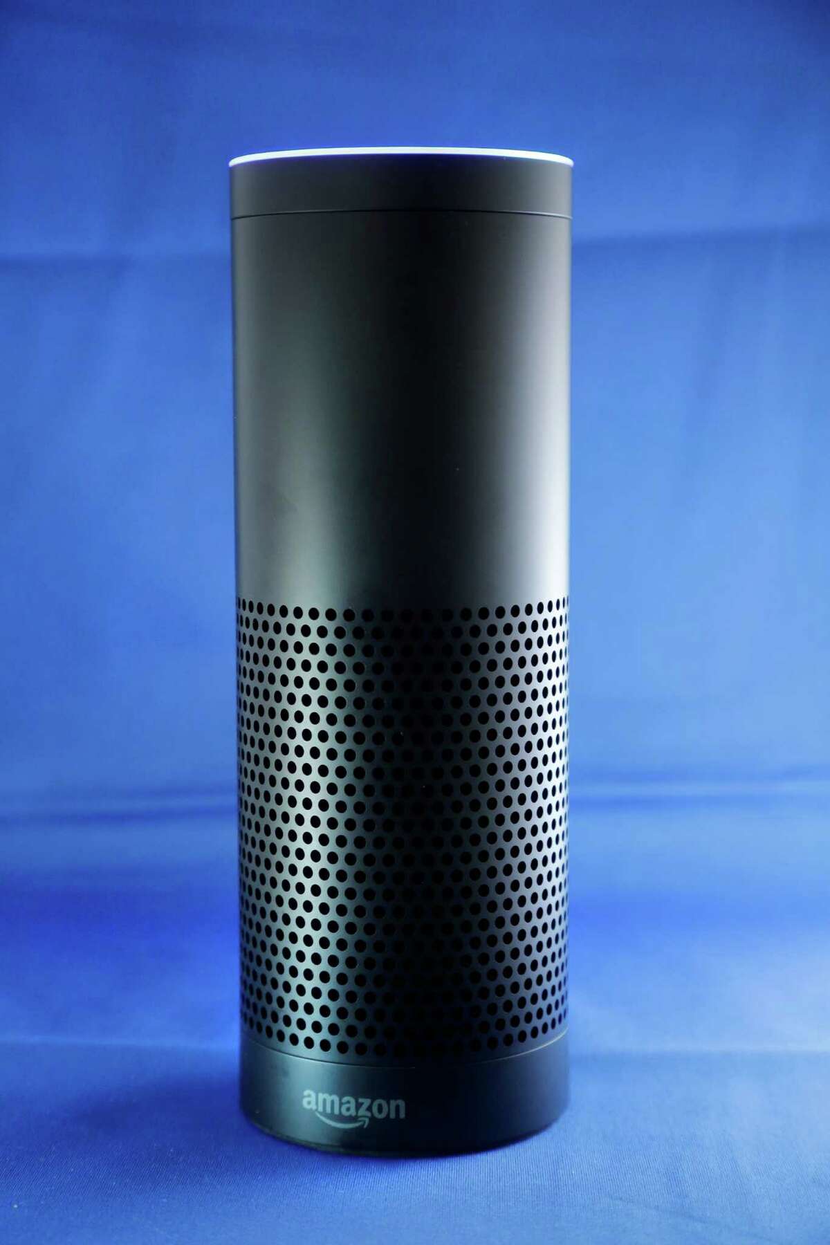 Amazon's Echo, a digital assistant that can be set up in a home or office to listen for various requests, such as for a song, a sports score, the weather, or even a book to be read aloud. (AP Photo/Mark Lennihan)