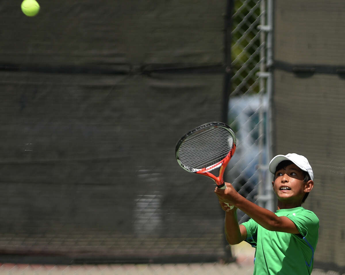 J.C. Roddick, nephew of tennis star Andy Roddick, hits a backhand lob against opponent Samuel Rubell in the USTA National Championship Boys’ 14 Singles Consolation event at the McFarlin Tennis Center on Tuesday, Aug. 4, 2015.