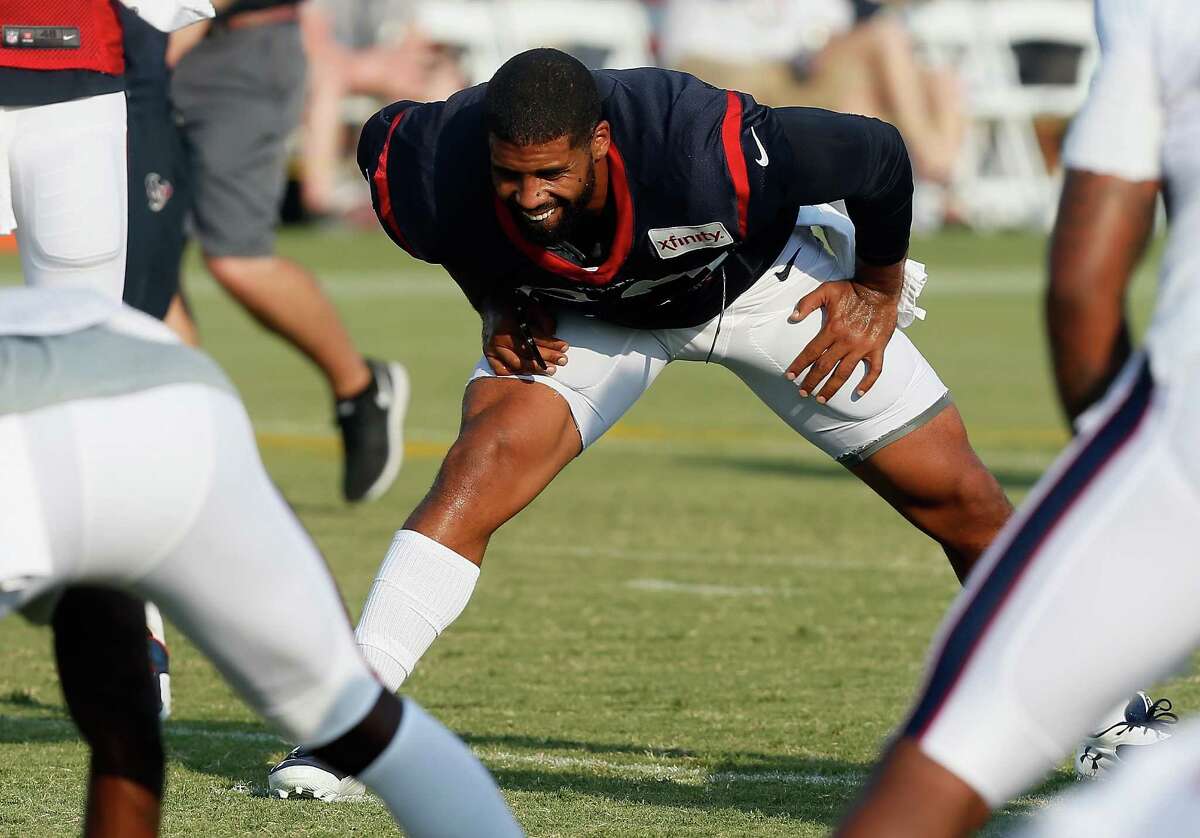 Houston Texans running back Arian Foster (23) stretches during an NFL football training camp at the Methodist Training Center on Monday, Aug. 3, 2015 in Houston.
