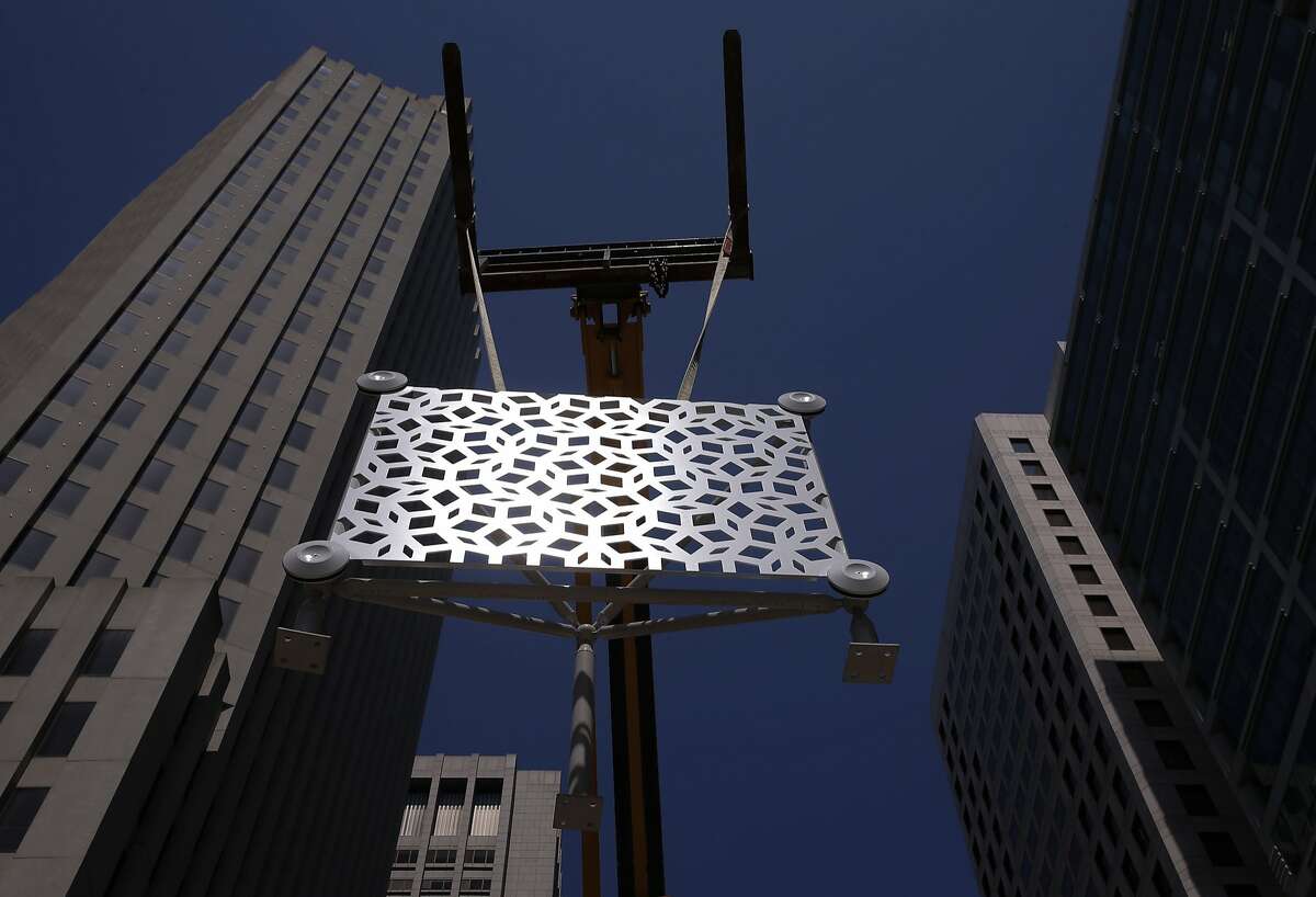 One of the prototype panels that will cover the exterior of the Transbay Transit Center is displayed in downtown San Francisco, Calif., on Wed. August 5, 2015. The surface had a built in reflective surface in the white paint covering.