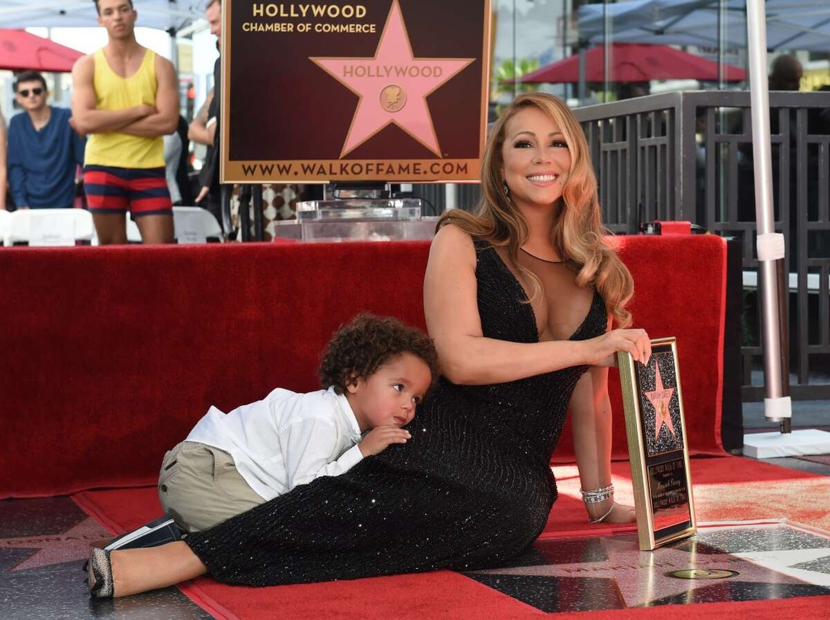 Singer Mariah Carey with son Moroccan Cannon is honored with the 2,556th star on The Hollywood Walk of Fame in Hollywood, California on August 5, 2015. Mariah Carey is the best-selling female artist of all time with more than 200-million albums sold so far and 18 Billboard Hot 100 No. 1 singles. AFP PHOTO/MARK RALSTONMARK RALSTON/AFP/Getty Images