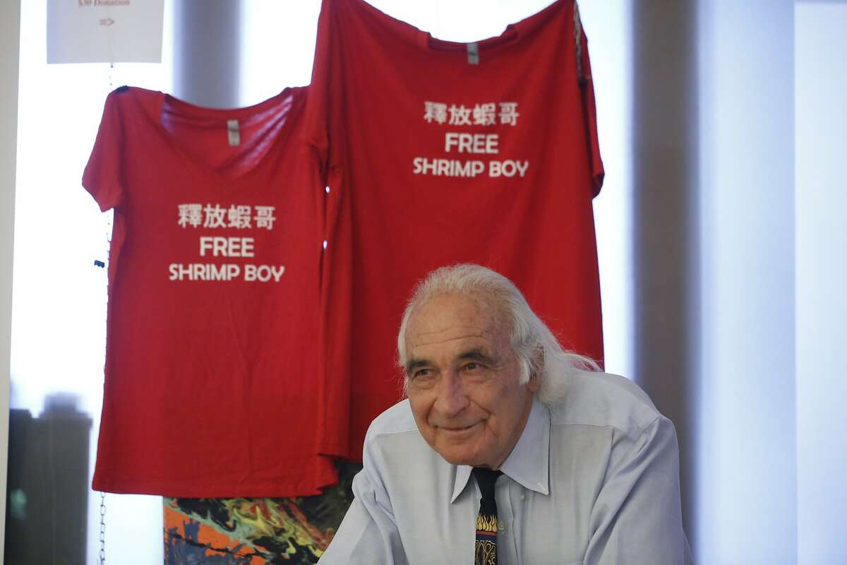 Famed criminal defense attorney Tony Serra, 79, who is representing Raymond "Shrimp Boy" Chow in the money laundering case that has also ensnared Leland Yee, shows off "Free Shrimp Boy" t-shirts his office is selling for $30 a piece to raise money for the case on July 15, 2014 in San Francisco, Calif.