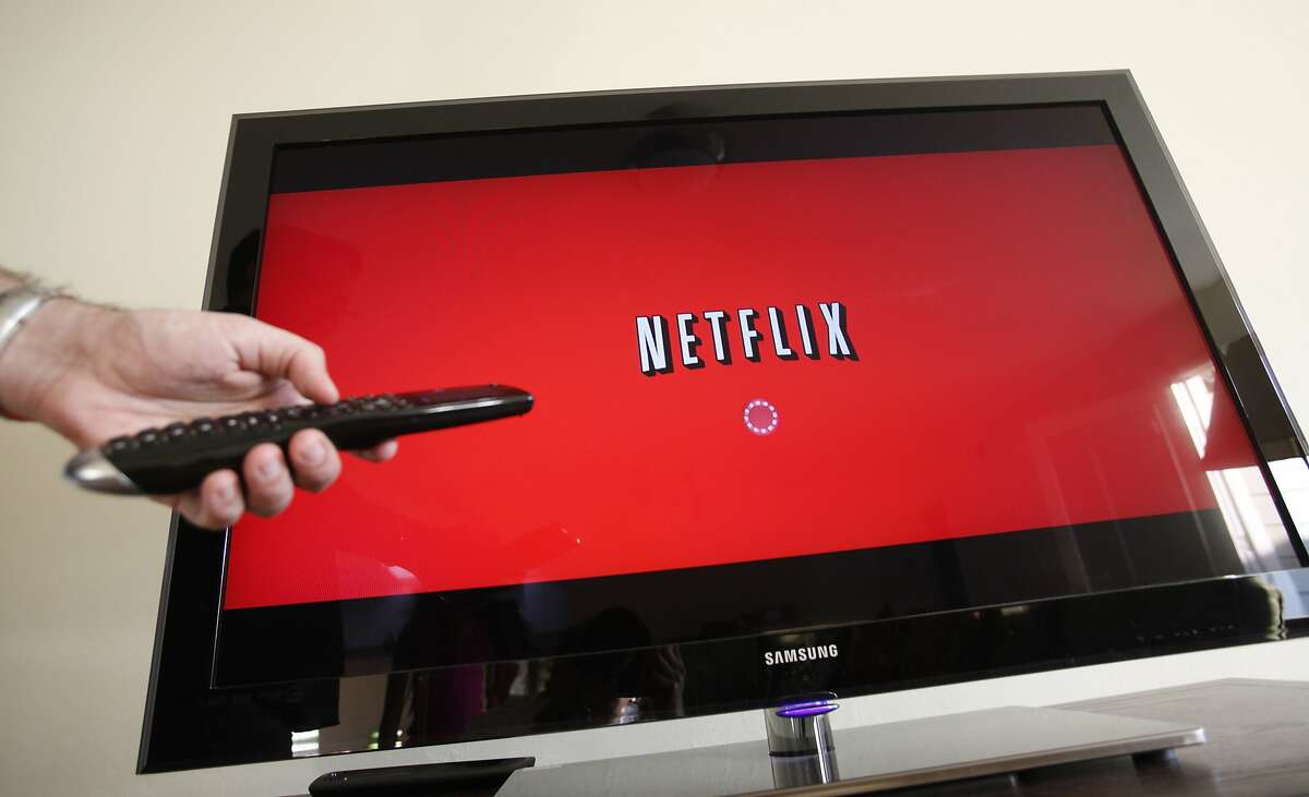 FILE - In this July 20, 2010 file photo, a person uses Netflix in Palo Alto, Calif. Netflix on Tuesday, Aug. 4, 2015 said it will expand into Japan beginning Sept. 2, 2015 to give the Internet video service its first presence in Asia. (AP Photo/Paul Sakuma, File)