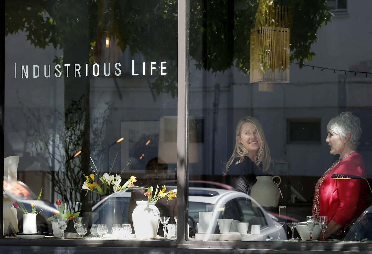 Industrious Life owner Patti Davidson (left) and college Patti Quill pause in the store on Tennessee Street in San Francisco, Calif. New Dogpatch district shop called Industrious Life with quality modern home furnishings and design.