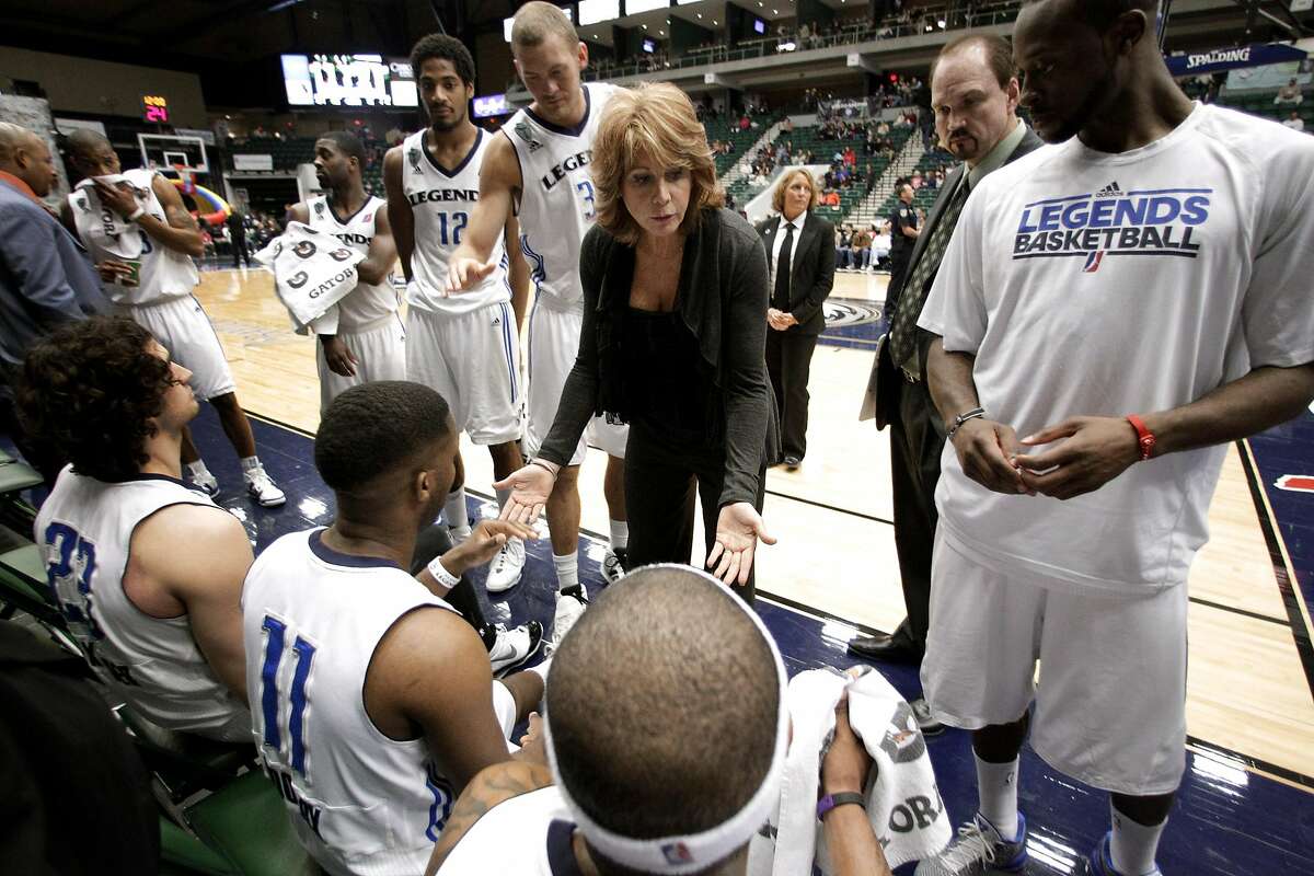 FILE - In this March 30, 2011 file photo, Texas Legends head coach Nancy Lieberman, center, leads her team during a time out in an NBA Development League basketball game against the Springfield Armor in Frisco, Texas. A person with knowledge of the decision says Lieberman has agreed to become an assistant coach with the Sacramento Kings, joining Becky Hammon of the San Antonio Spurs as another female NBA assistant coach. The Kings were expected to make a formal announcement later Friday, July 31, 2015, the person said, speaking on condition of anonymity because the team hadn't made it official. (AP Photo/Tony Gutierrez, File)
