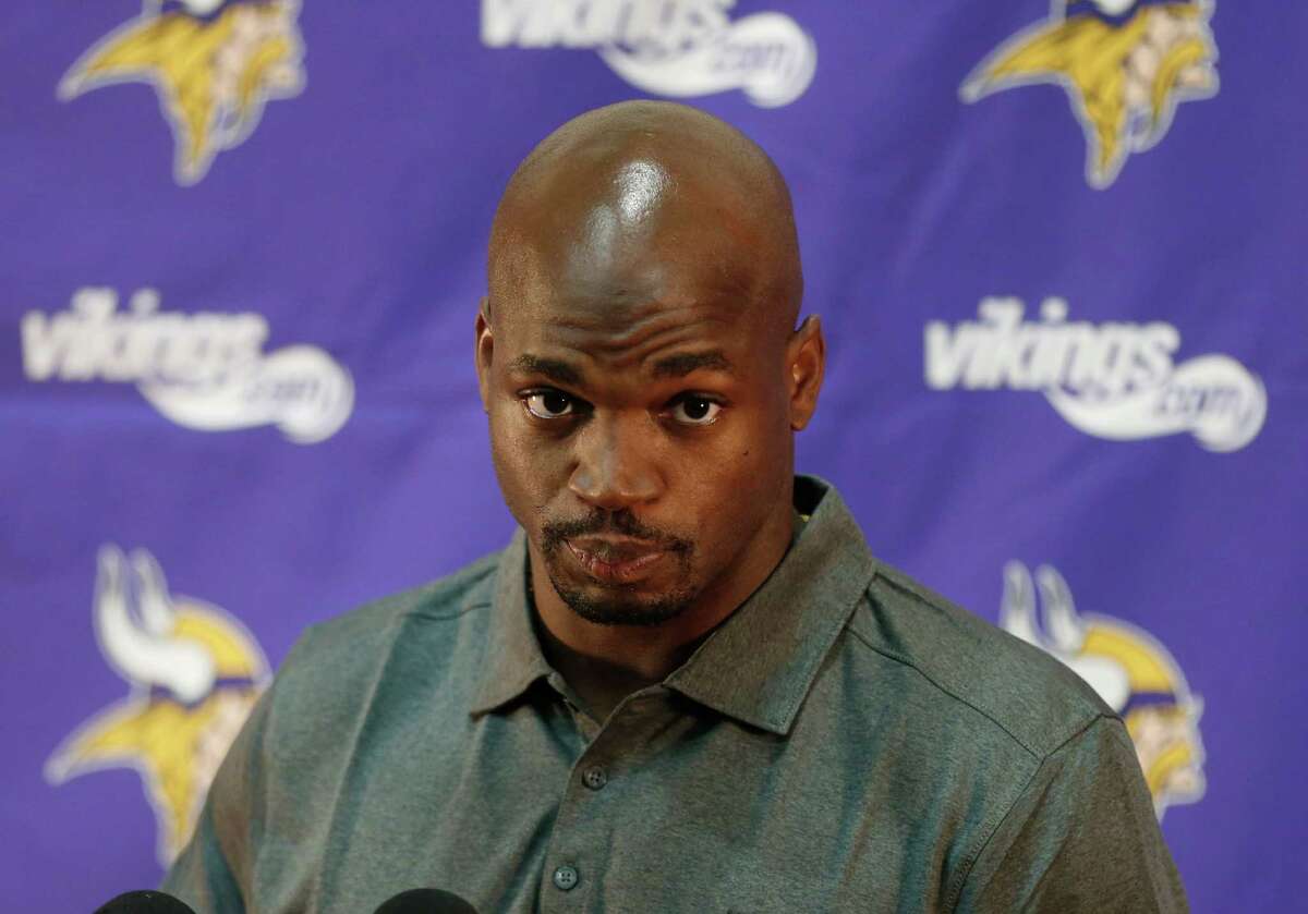 Minnesota Vikings running back Adrian Peterson listens to a question during a news conference at the team's NFL football headquarters, Tuesday, June 2, 2015 in Eden Prairie, Minn., after he took part in voluntary practice. Peterson missed the final 15 games of last season while addressing child abuse charges in Texas. (AP Photo/Jim Mone)