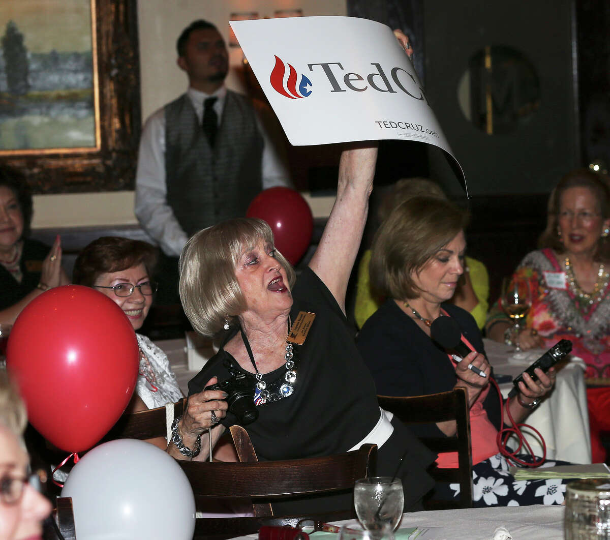 Loyette Schott roots for her candidate during the GOP debate watch party at Maggiano's Little Italy on August 6, 2015.