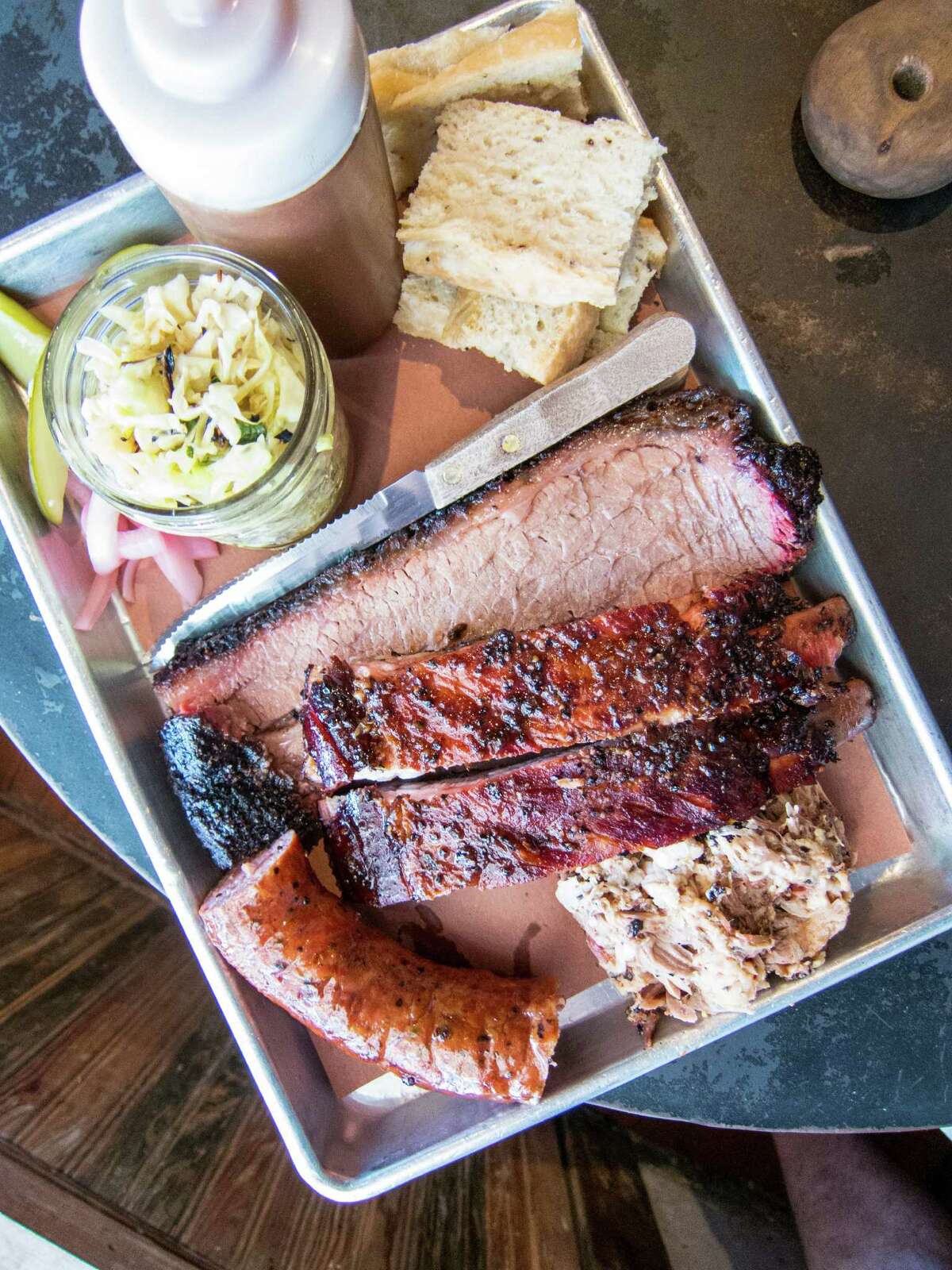 The "Holy Trinity Plate" - brisket, ribs, sausage - at Freedmen's Bar in Austin﻿.
