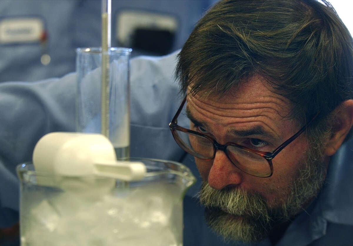 Mike Strange, of San Antonio Water Systems' Eastside Service Center, tests a sample of fluoride upon its arrival at the center on July 25, 2002. It was the first shipment of the fluoride to be used in the fluorination of the city's water suplly.