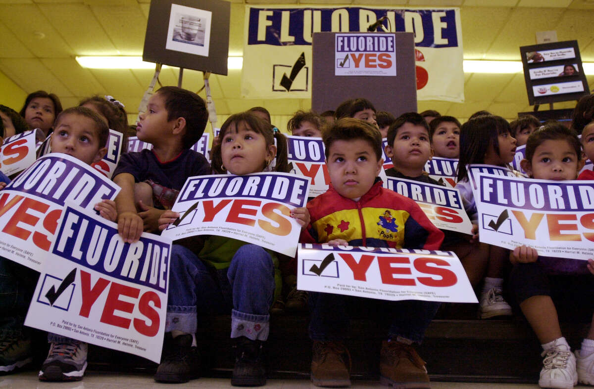 Children from the Jose Cardenas Headstart Program await the start of the pro-fluoridation rally at the Jose Cardenas Community Center on Sept. 18, 2000. Mayor Howard Peak and various educational, civic and medical leaders attended to gather support for the measure that San Antonio were scheduled tovote on that November.