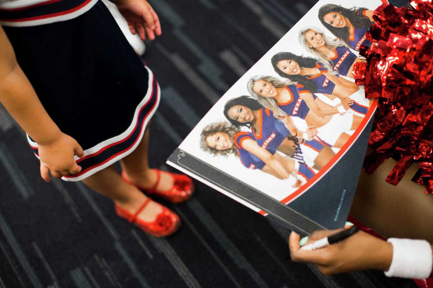 Texans' cheerleaders unveil annual swimsuit calendar