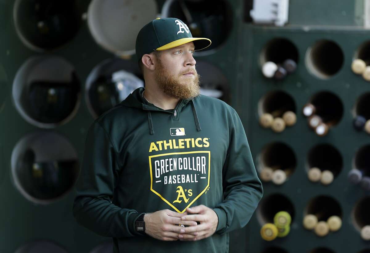 Oakland Athletics pitcher Sean Doolittle looks out from the dugout prior to the baseball game against the Cleveland Indians Saturday, Aug. 1, 2015, in Oakland, Calif. (AP Photo/Ben Margot)
