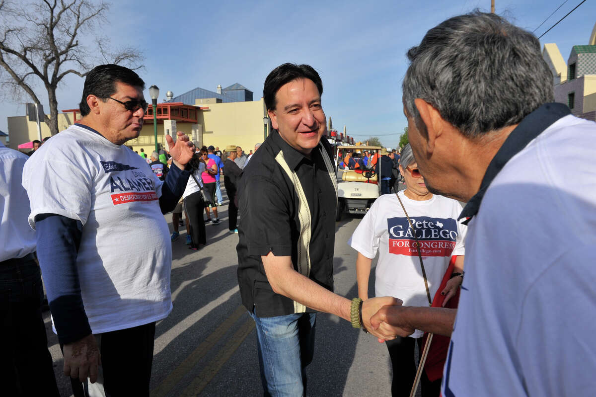 Congressman Pete Gallego shakes hands with supporters prior to the start of the Cesar Chavez March Saturday.