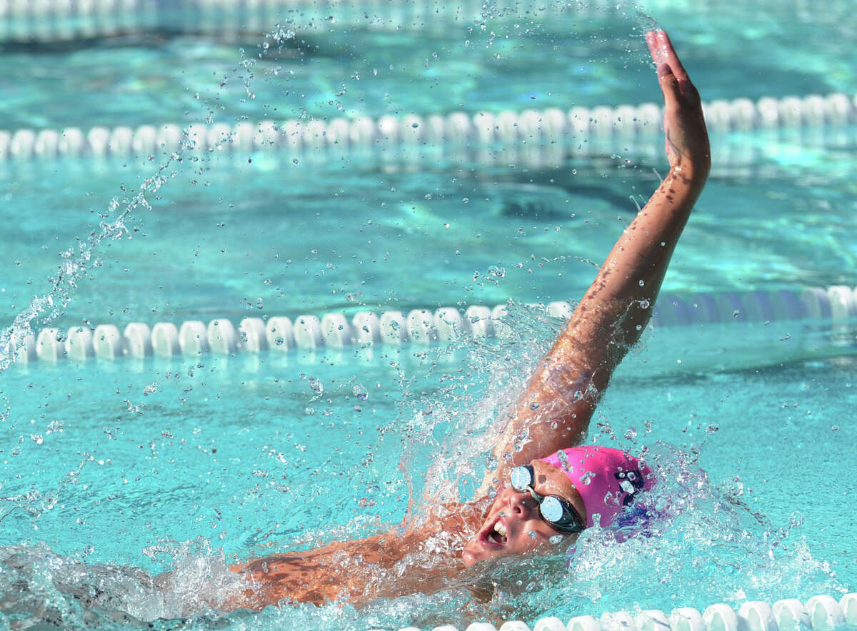 William Montesi of the the Roxbury Club competes in the backstroke event during the 67th annual Fairfield County Swimming League Championship Finals at the Roxbury Swim & Tennis Club, Stamford, Conn., Saturday, Aug. 8, 2015.