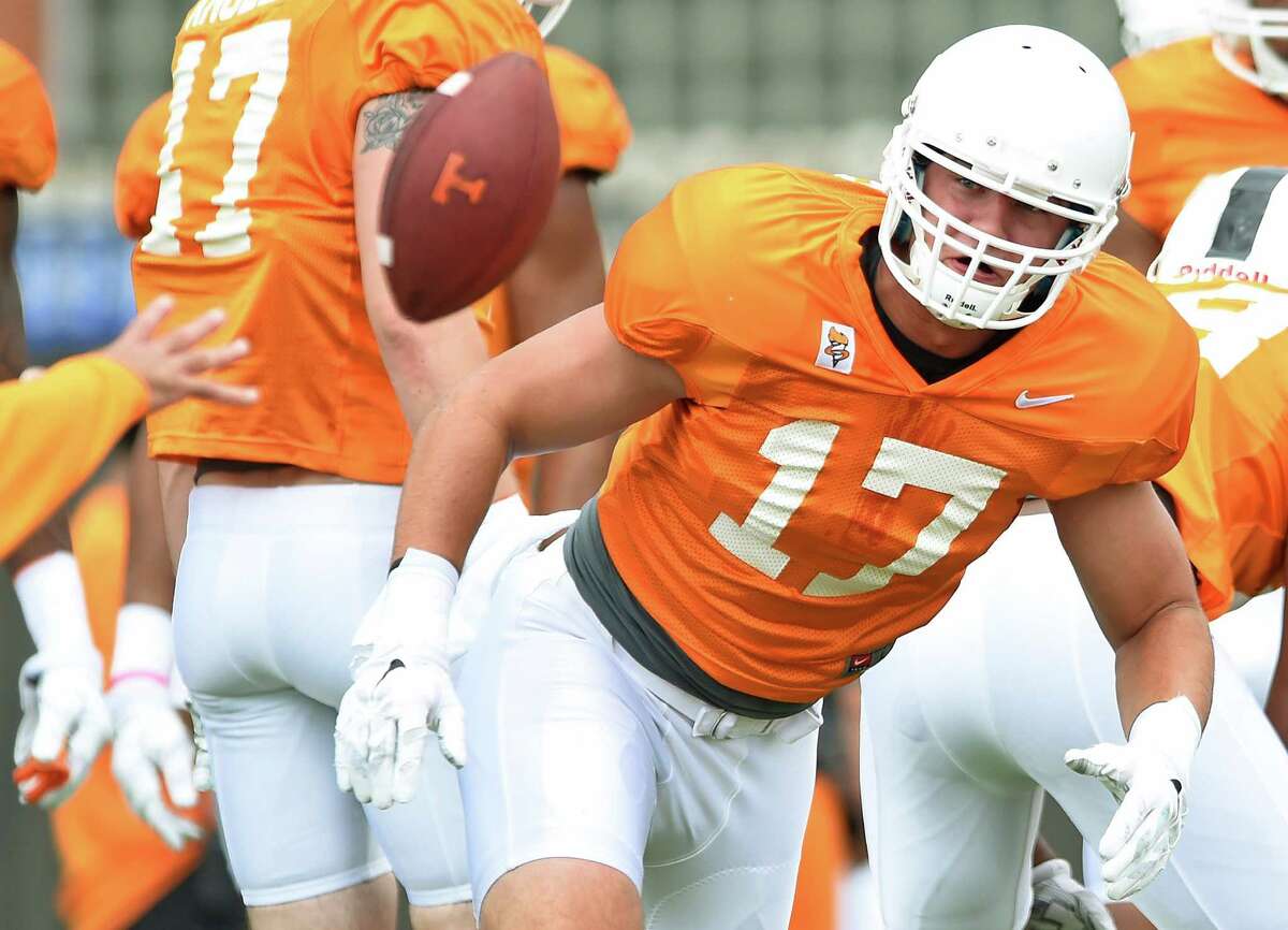 Tennessee linebacker Dillon Bates (17) dives for a ball while running drills during NCAA college football practice Friday, Aug. 7, 2015, in Knoxville, Tenn. (Adam Lau/Knoxville News Sentinel via AP)