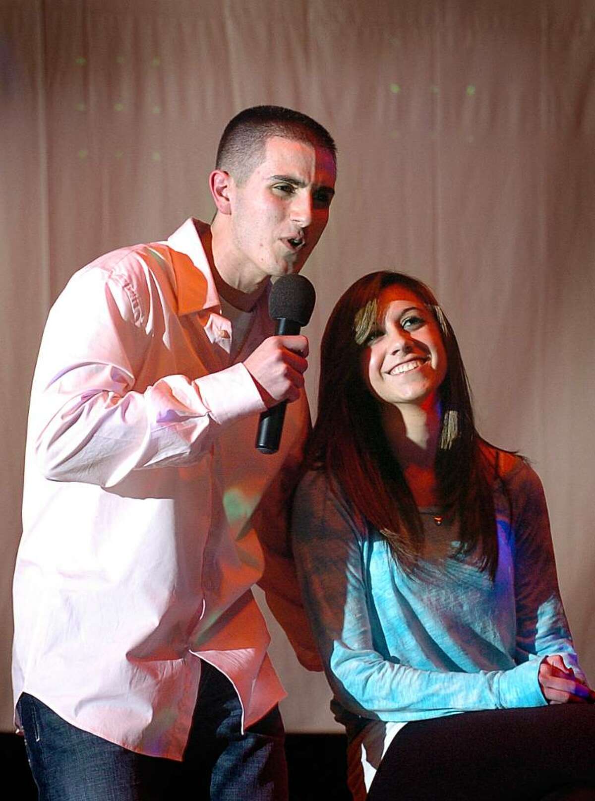 Steve Loschiavo serenades girlfriend Mallory Morlando on stage during the talent portion of St. Joseph's fourth annual Mr. Student Body Competition Thursday Mar. 18, 2010 at the school in Trumbull. Proceeds benefit the Center for Women and Families of Bridgeport and their White Ribbon Campaign, in which men and boys oppose violence against women.