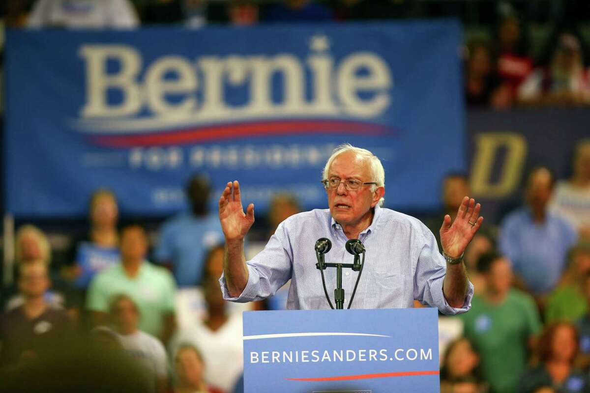 Bernie Sanders speaks during a rally at Hec Ed Pavilion that drew an estimated 15,000 people to the University of Washington. The rally filled the arena and left thousands outside. Earlier in the day Sanders participation in a rally at Westlake Park was cut short because protesters took over the microphone. Photographed on Saturday, August 8, 2015.