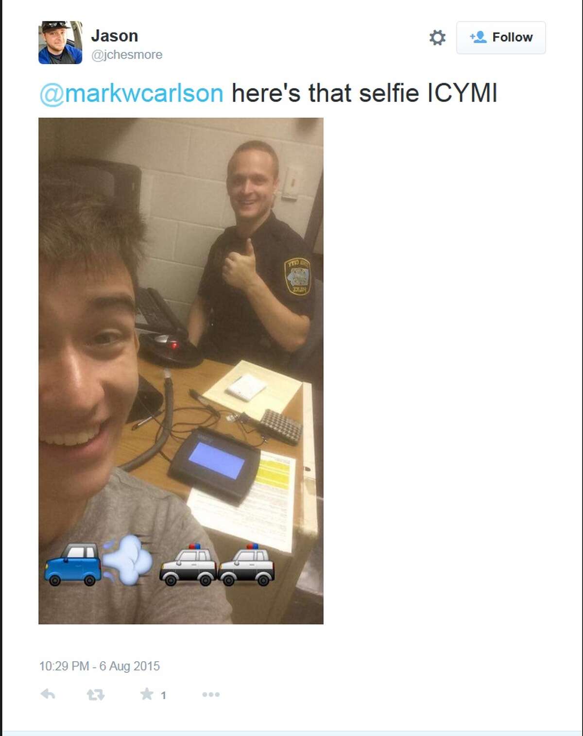 Gilbert Phelps’ original selfie, emojis and all, with his arresting officer that was shared around Twitter.