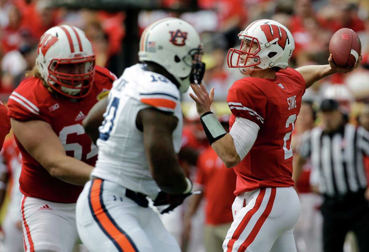 Wisconsin quarterback Joel Stave (2) throws a pass against Auburn during the first quarter of the Outback Bowl NCAA college football game Thursday, Jan. 1, 2015, in Tampa, Fla. (AP Photo/Chris O'Meara)