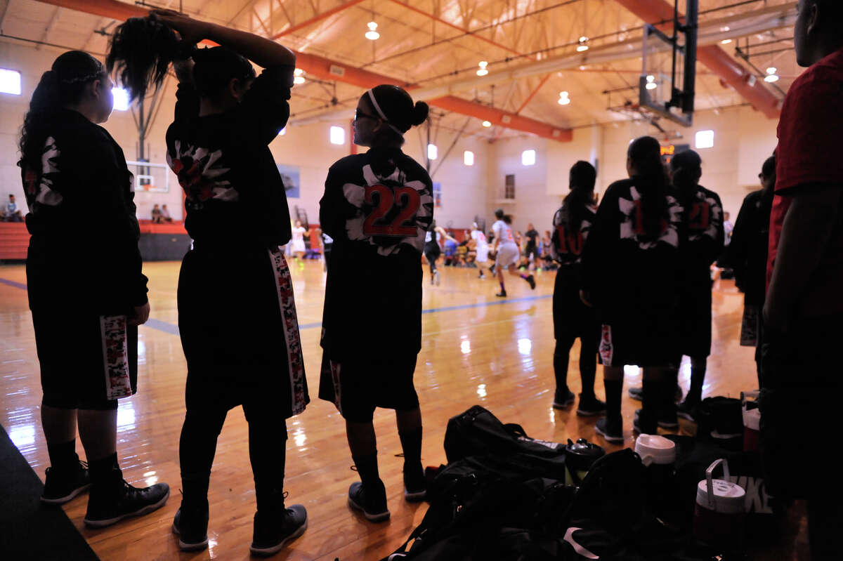 Members of the San Antonio Outlaws wait for a recent tournament game to begin.