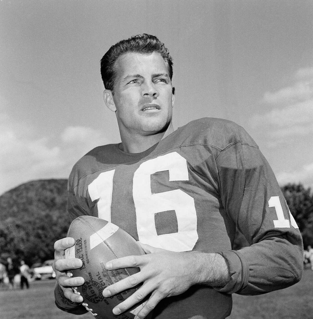 FILE - In this Sept. 9, 1958 file photo, New York Giants halfback Frank Gifford participates in a workout in New York. In a statement released by NBC News on Sunday, Aug. 9, 2015, his family said Gifford died suddenly at his Connecticut home of natural causes that morning. (AP Photo/John Rooney, File) ORG XMIT: NY120