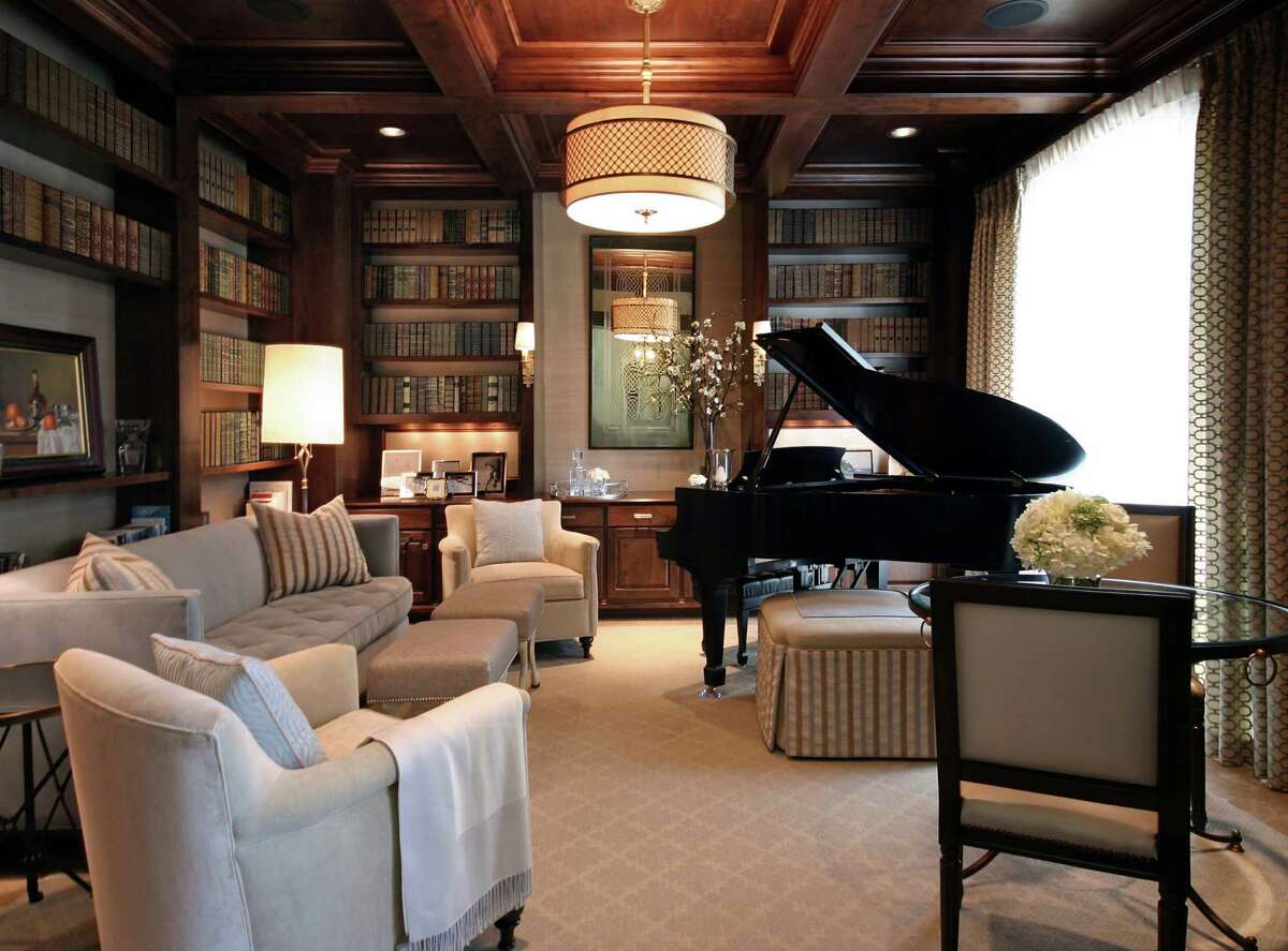 AFTER: Designer Ben Johnston used a cool, neutral color palette to brighten the room and made the Steinway piano a focal point﻿. 
