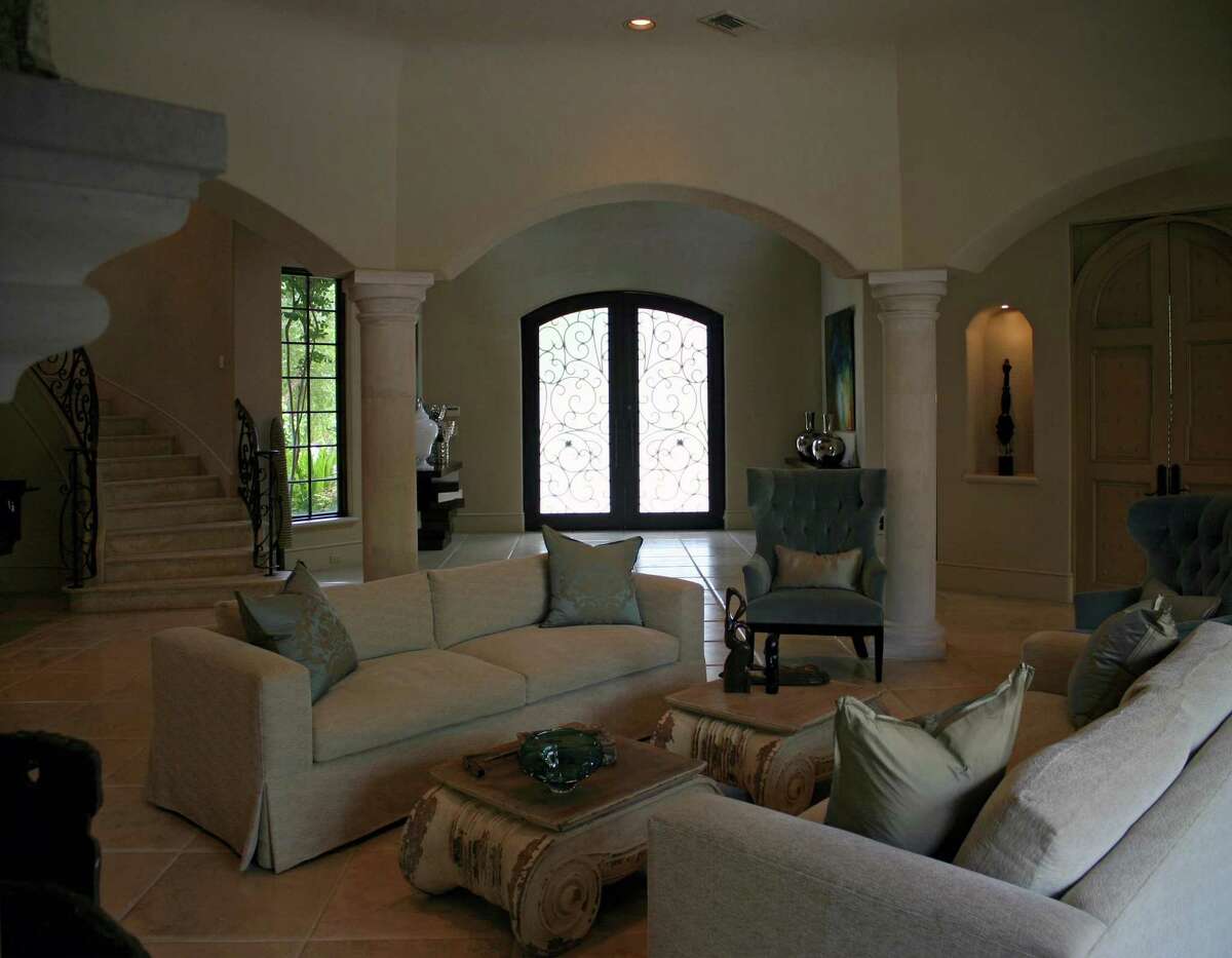BEFORE: This Mediterranean-style home had wide-open spaces but decor that seemed common and small-scale.