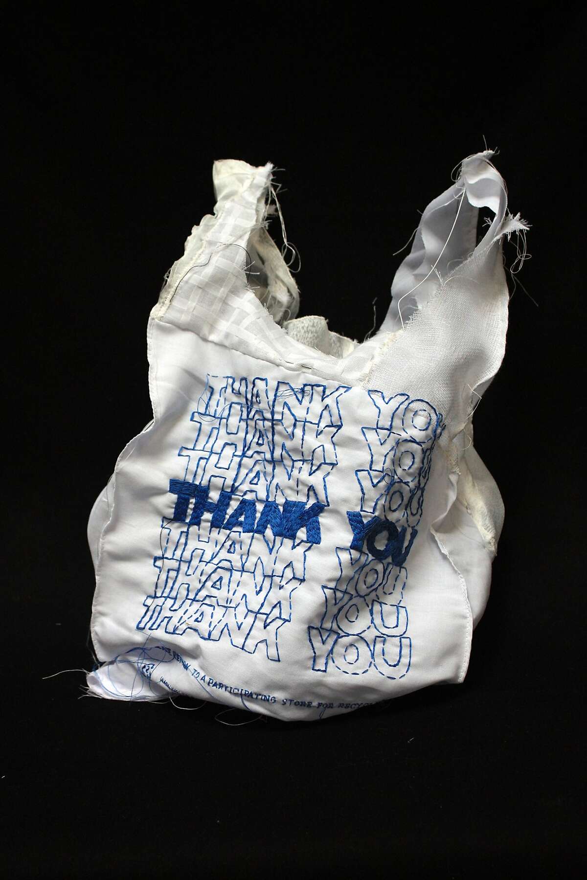 Lauren DiCioccio?•s hand-embroidered and quilted 2011 work ?’Thank You Bag (White and Blue)?“ appears in ?’Make Art, Not Landfill: The 25th Anniversary of the Recology Artist in Residence Program?“ through Sept. 10 at the Thoreau Center for Sustainability. Courtesy of Recology San Francisco, Art at the Dump