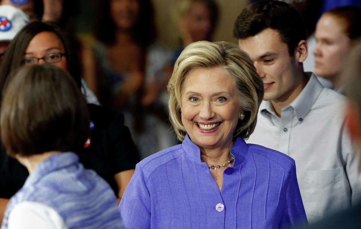 Democratic presidential candidate Hillary Rodham Clinton arrives at the high school in Exeter, N.H., Monday, Aug. 10, 2015, where she announced her college affordability plan. (AP Photo/Jim Cole)