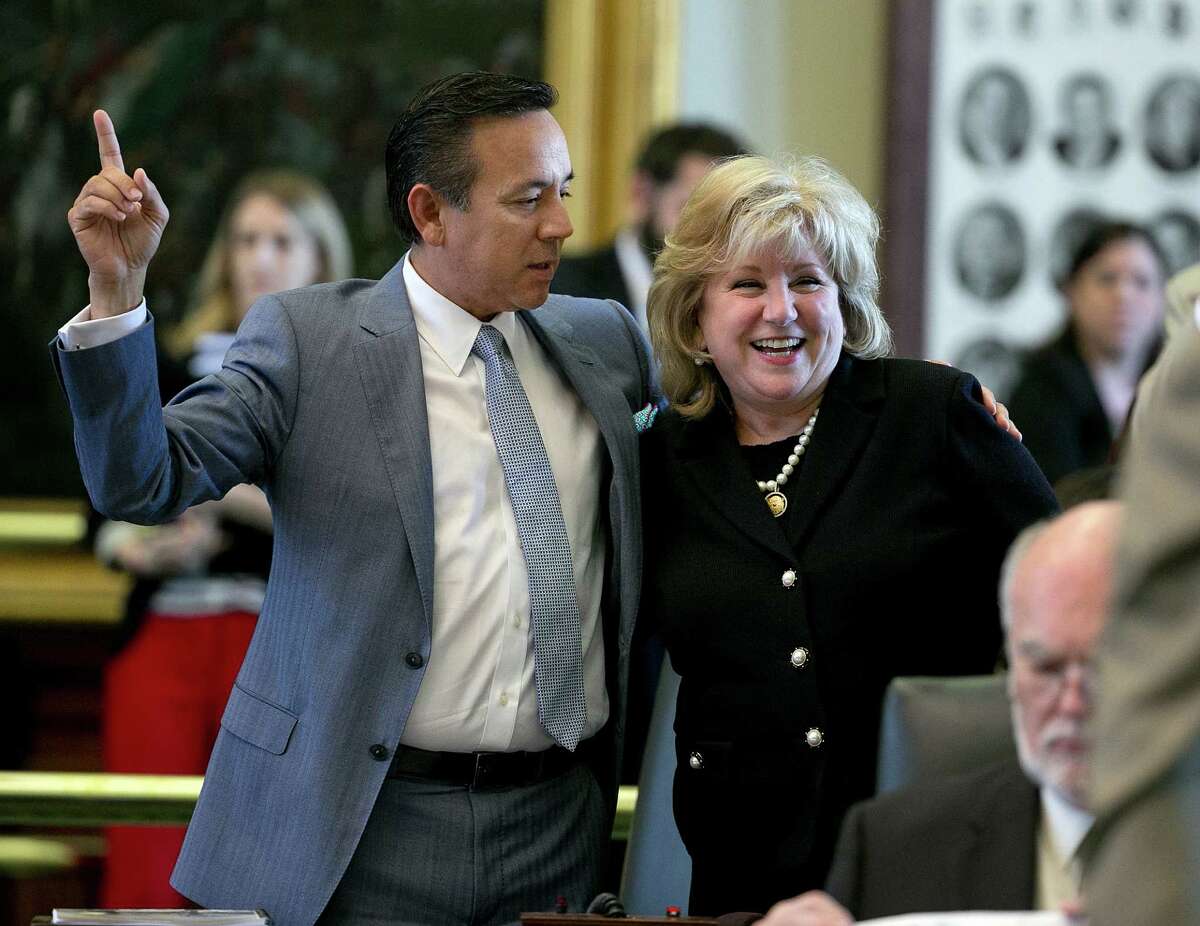 Senator Jane Nelson is congratulated by Senator Carlos Uresti during passage of SB1 at the Capitol in Austin, Texas on Friday, May 29, 2015. On a 30-1 Senate vote, the only bill lawmakers must pass during the 140-day session was approved Friday. The House later endorsed it 115-33. (Deborah Cannon/Austin American-Statesman via AP)