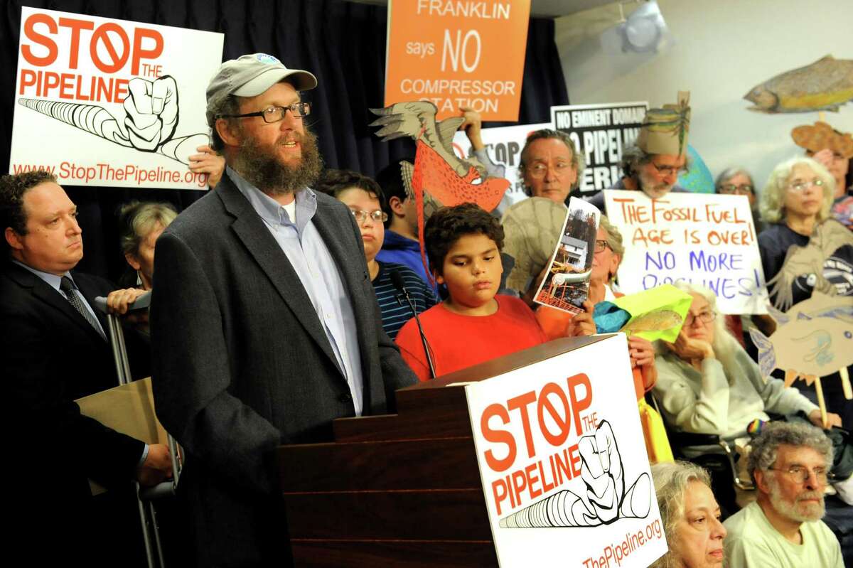 Wes Gillingham, program director of Catskill Mountainkeeper, center, speaks during a news conference to call on the DEC to stop the Constitution gas pipeline on Tuesday, Aug. 11, 2015, at the Legislative Office Building in Albany, N.Y. (Cindy Schultz / Times Union)