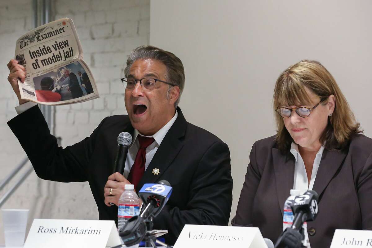Sheriff Ross Mirkarimi displays an article regarding San Francisco County jail as a model jail for prison realignment ,claiming credit as why he should be reelected sheriff during the debate at Zendesk on Tuesday, August 11, 2015 in San Francisco, Calif.
