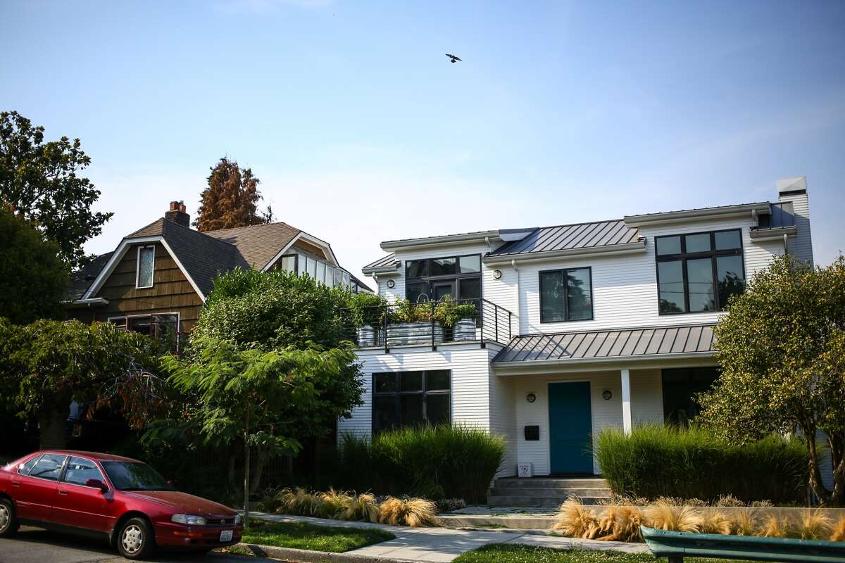 Lisa and Gary Mann, whose East Shelby Street home is pictured on the left, were sued by two neighbors who say that birds fed by the Mann family are destroying their homes in Seattle's Portage Bay neighborhood. Pictured Aug. 11, 2015.