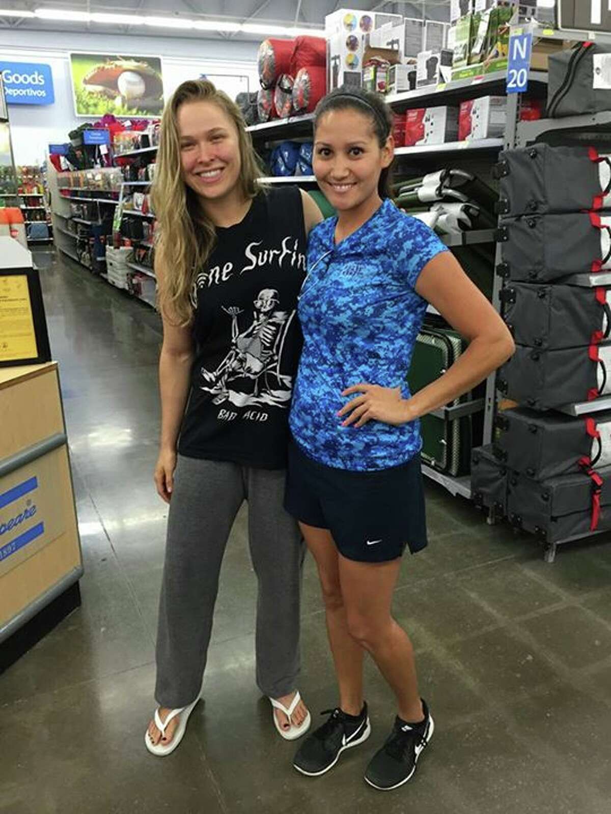 Kingsville residents were quick to snap photos with UFC champ Ronda Rousey at the Kingsville Walmart on Wednesday morning, Aug. 11, 2015.