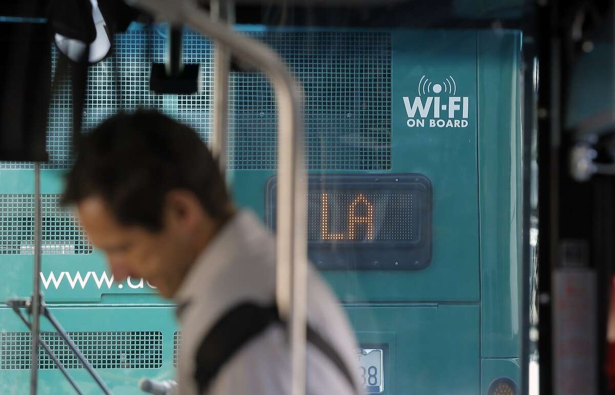 Wi-Fi enabled A/C transit buses wait in line to enter into the Transbay Terminal in San Francisco, Calif., on Wed. August 12, 2015.