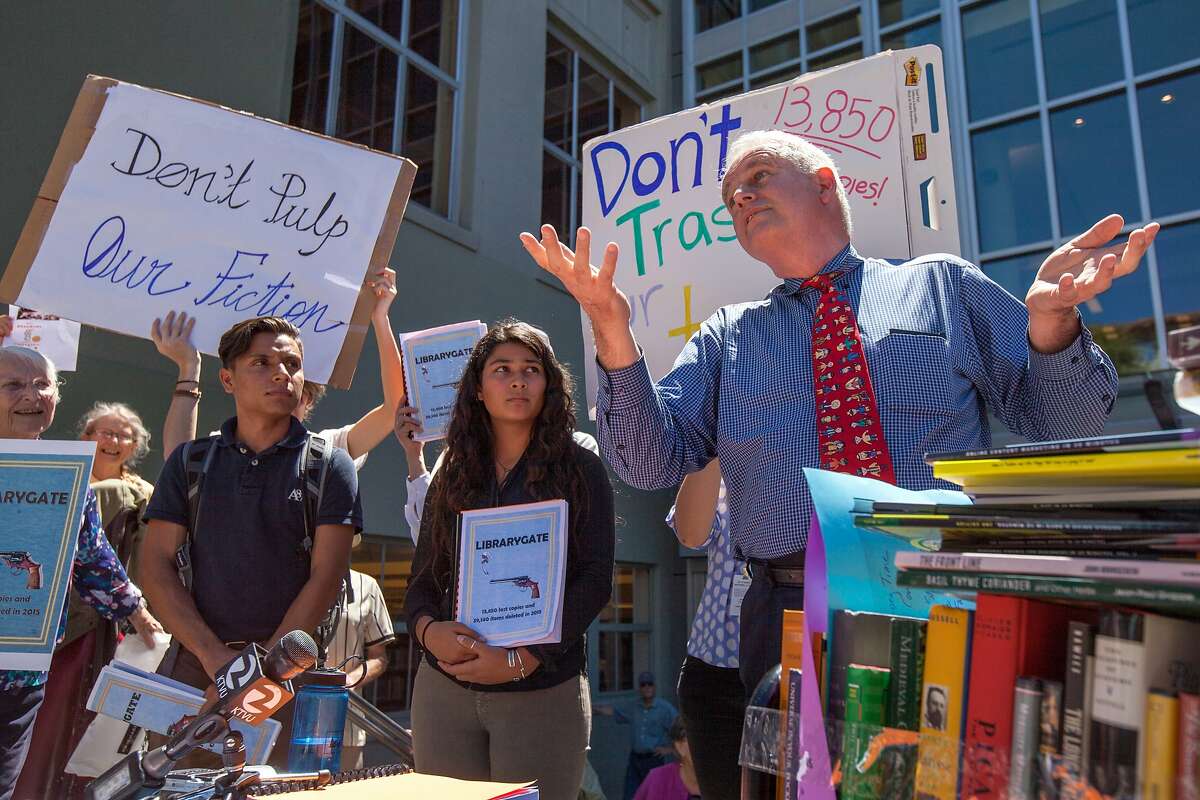 Berkeley councilmember Kriss Worthington, right, addresses Aug. 12, 2015 protest over at Berkeley Public Library over head librarian Jeff Scott's process or winnowing out old books. Scott has resigned over the controversy.