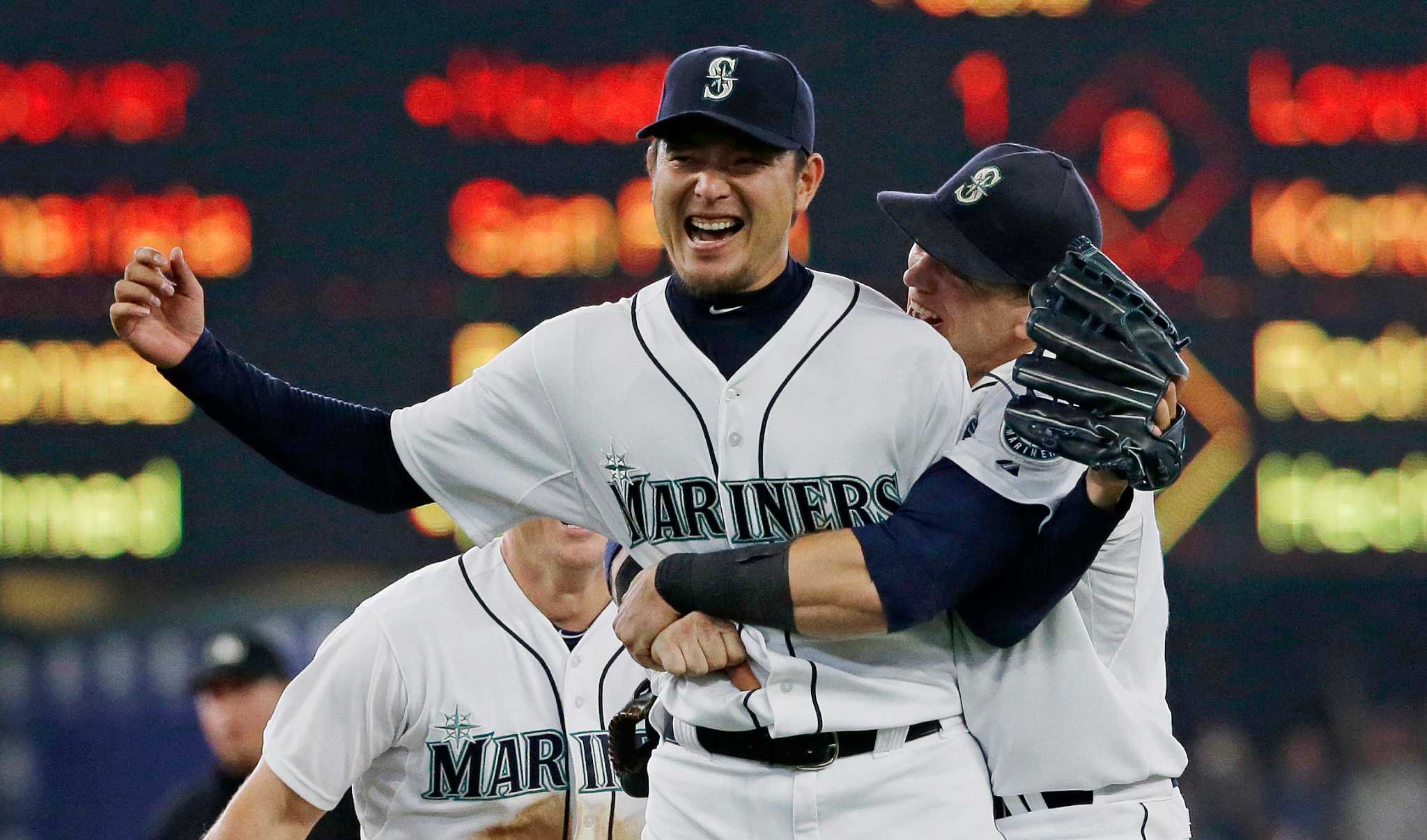 Seattle Mariners' first baseman Logan Morrison catches the throw